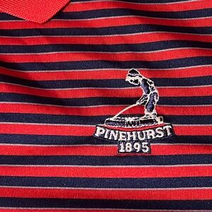 A red and blue striped Adidas Pinehurst golf shirt large in size